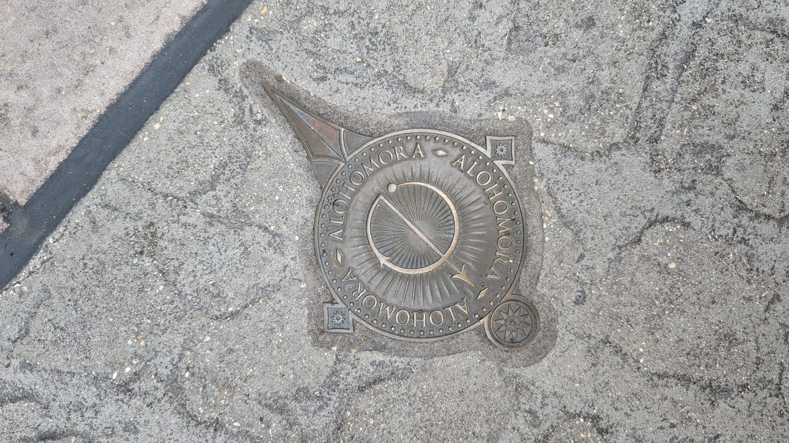 The Alohomora spell medallion in the pavement