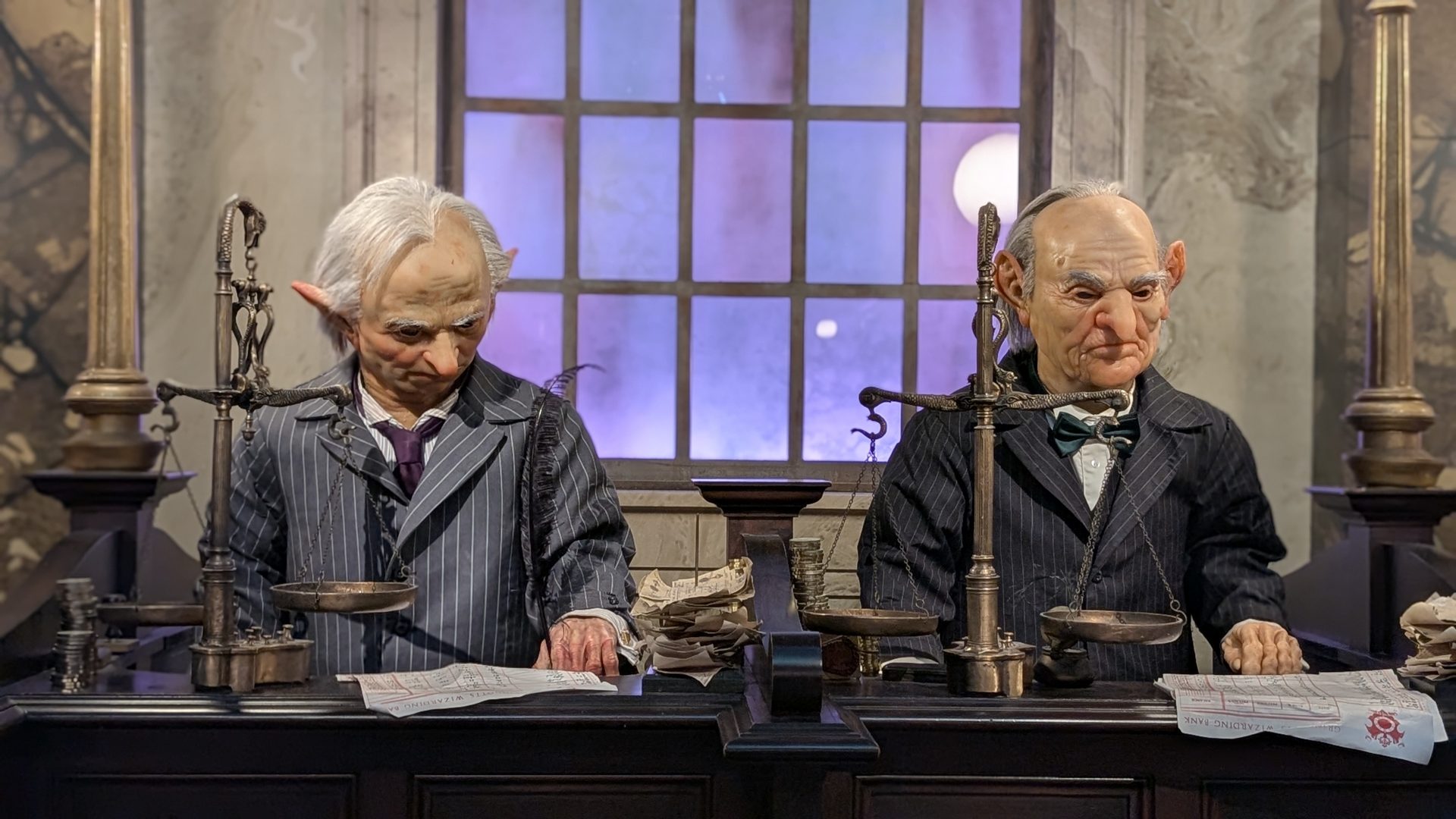 Goblin tellers weighing coins at the Gringotts Money Exchange in Diagon Alley