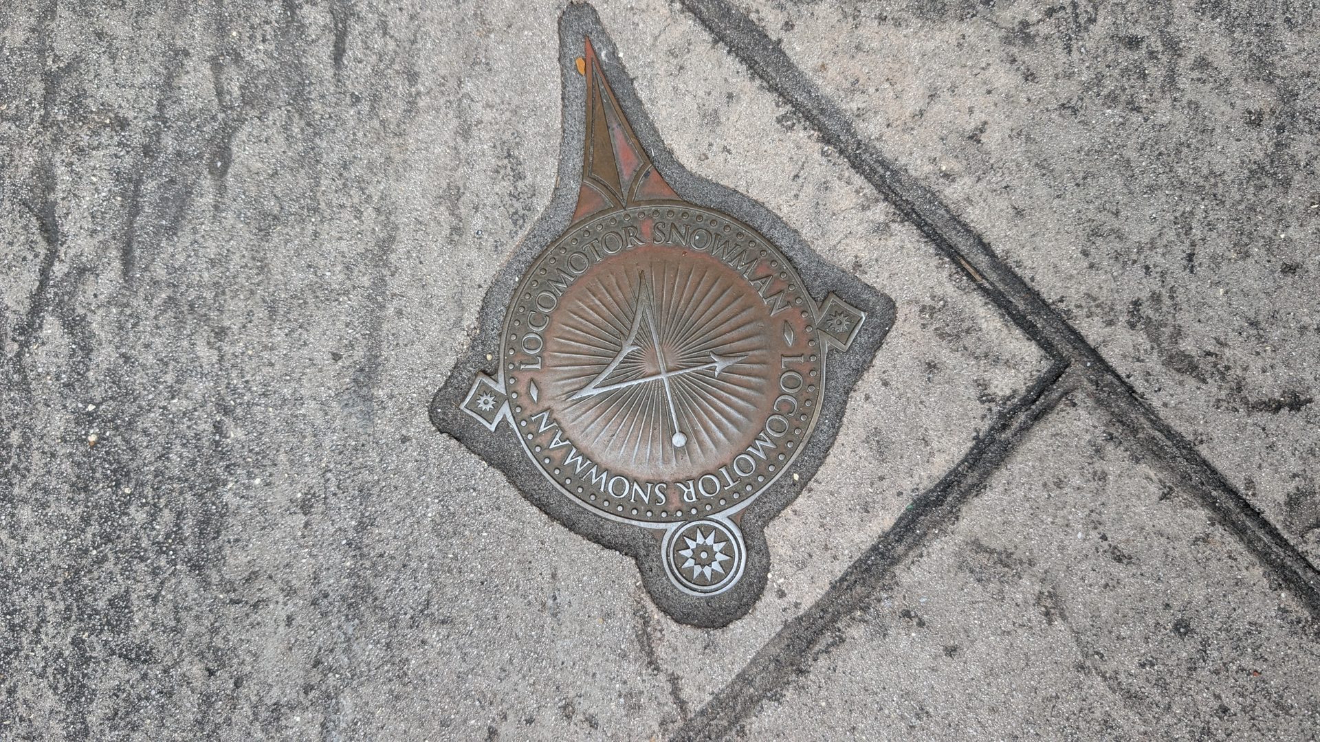 An interactive wand spell marker set in the pavement