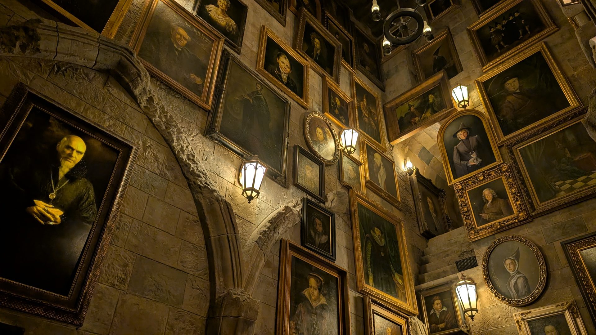 Moving portraits lining the staircase inside Hogwarts Castle