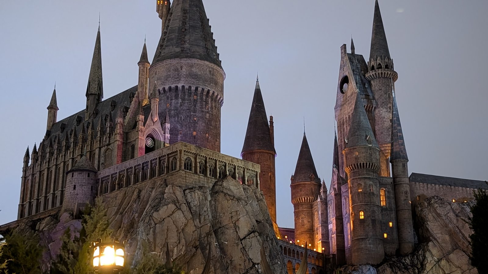 Hogwarts Castle glowing at dusk